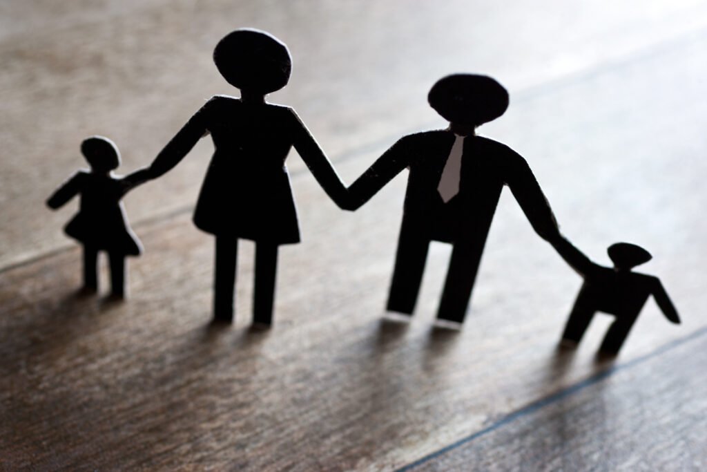 Silhouette showing a family holding hands